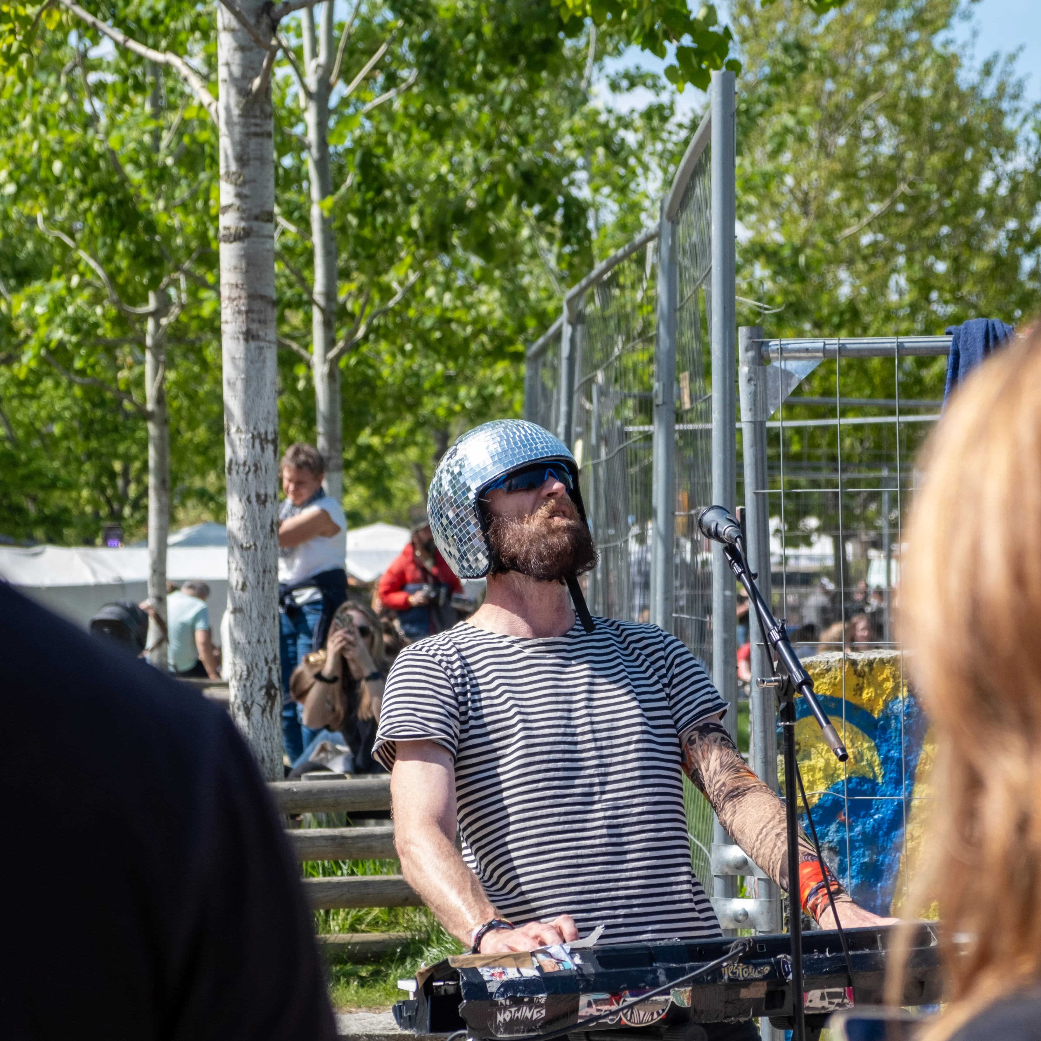 48mm · f/4 · 1/800s · ISO 200
FUJIFILM X-T5 · XF18-55mmF2.8-4 R LM OIS · Apr 28, 2024
Bearded man in disco ball helmet playing keyboard in Berlin.
Berlin, Germany
© Brandon Cook