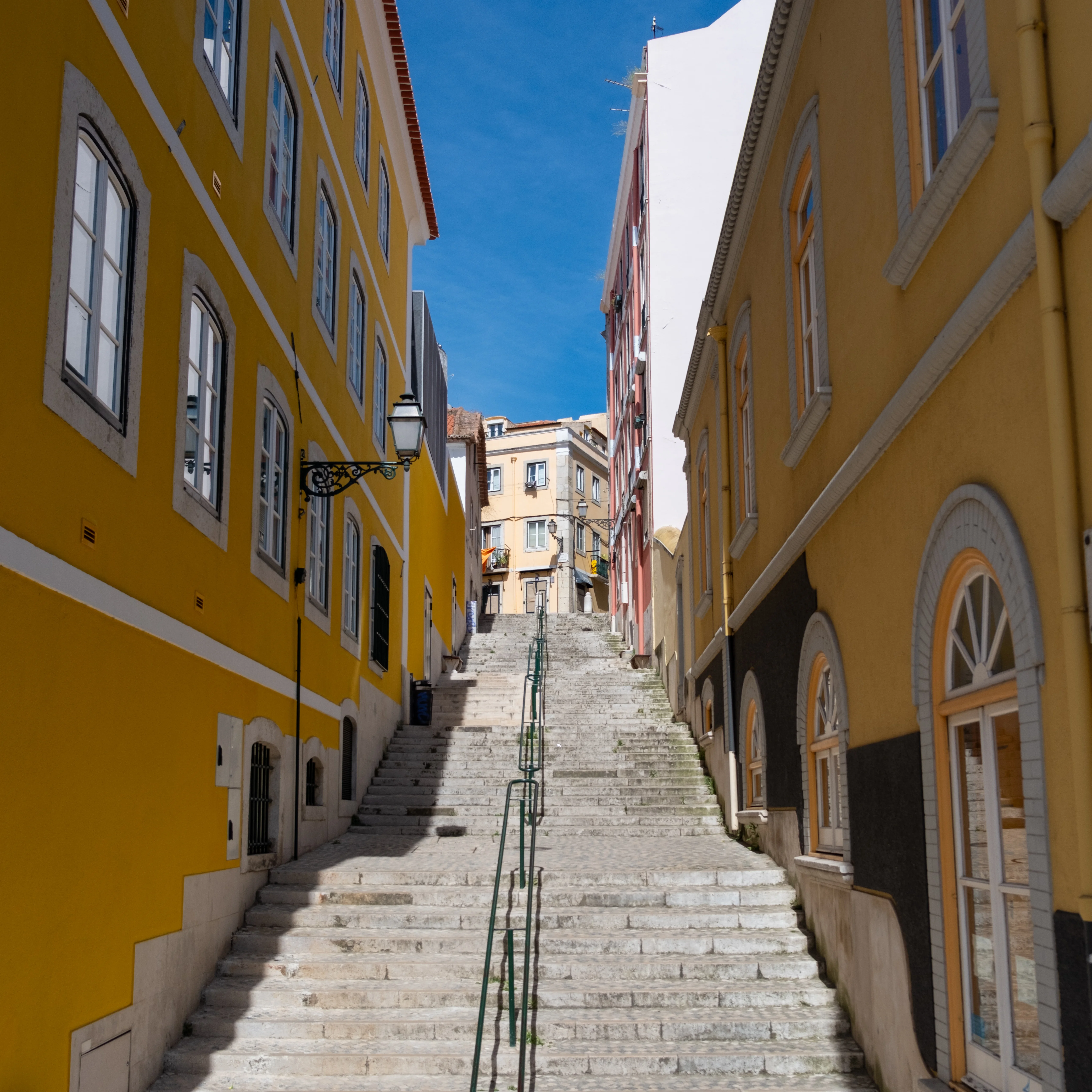 18mm · f/2.8 · 1/4000s · ISO 200
FUJIFILM X-T5 · XF18-55mmF2.8-4 R LM OIS · May 12, 2024
Narrow stone stairs between yellow buildings in Lisbon, Portugal.
Lisbon, Portugal
© Brandon Cook