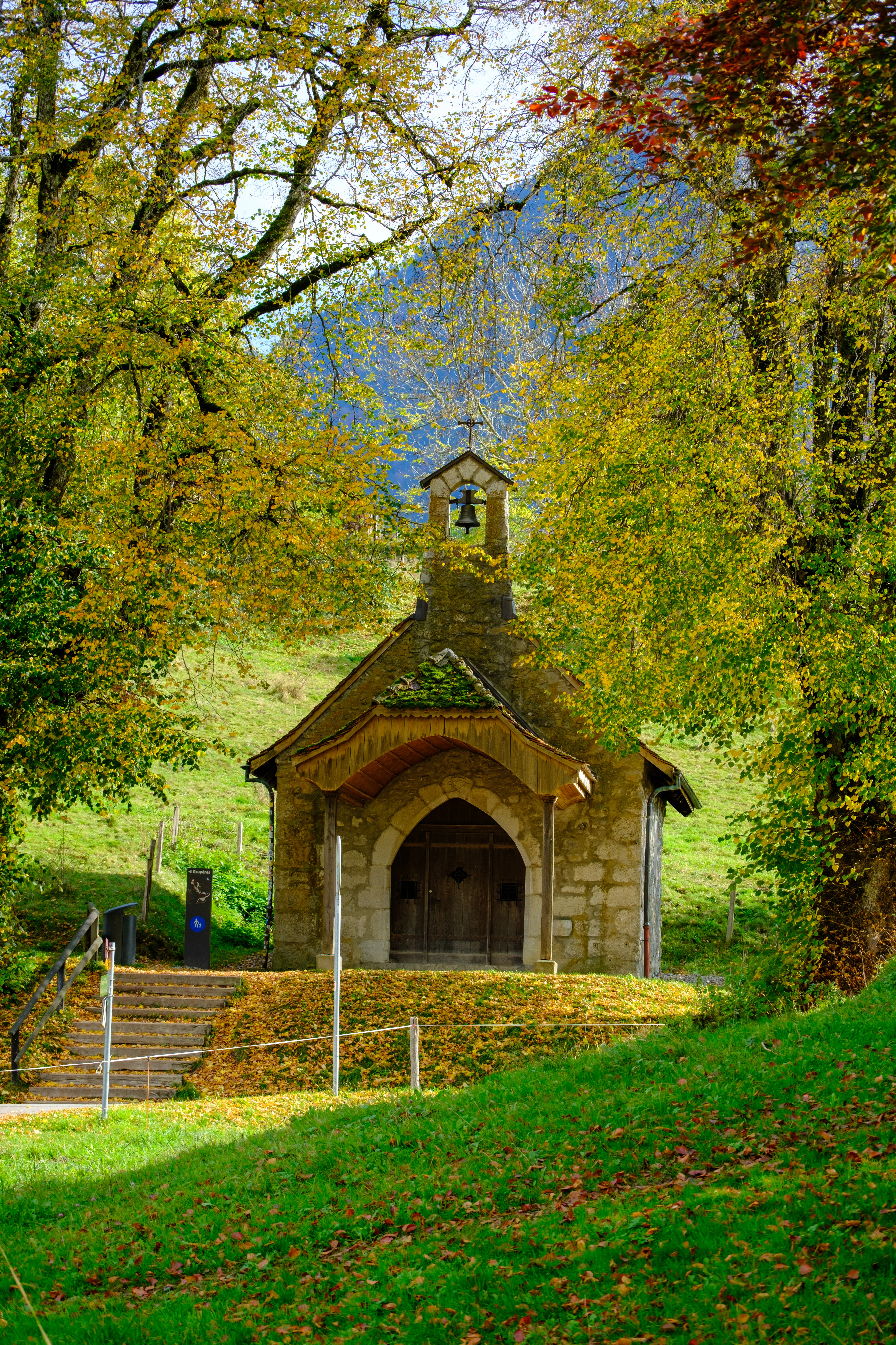 70mm · f/4.5 · 1/210s · ISO 125
FUJIFILM X-T5 · XF70-300mmF4-5.6 R LM OIS WR · Oct 22, 2024
Small stone chapel surrounded by golden autumn trees in Gruyères.
Gruyères, Switzerland
© Brandon Cook
