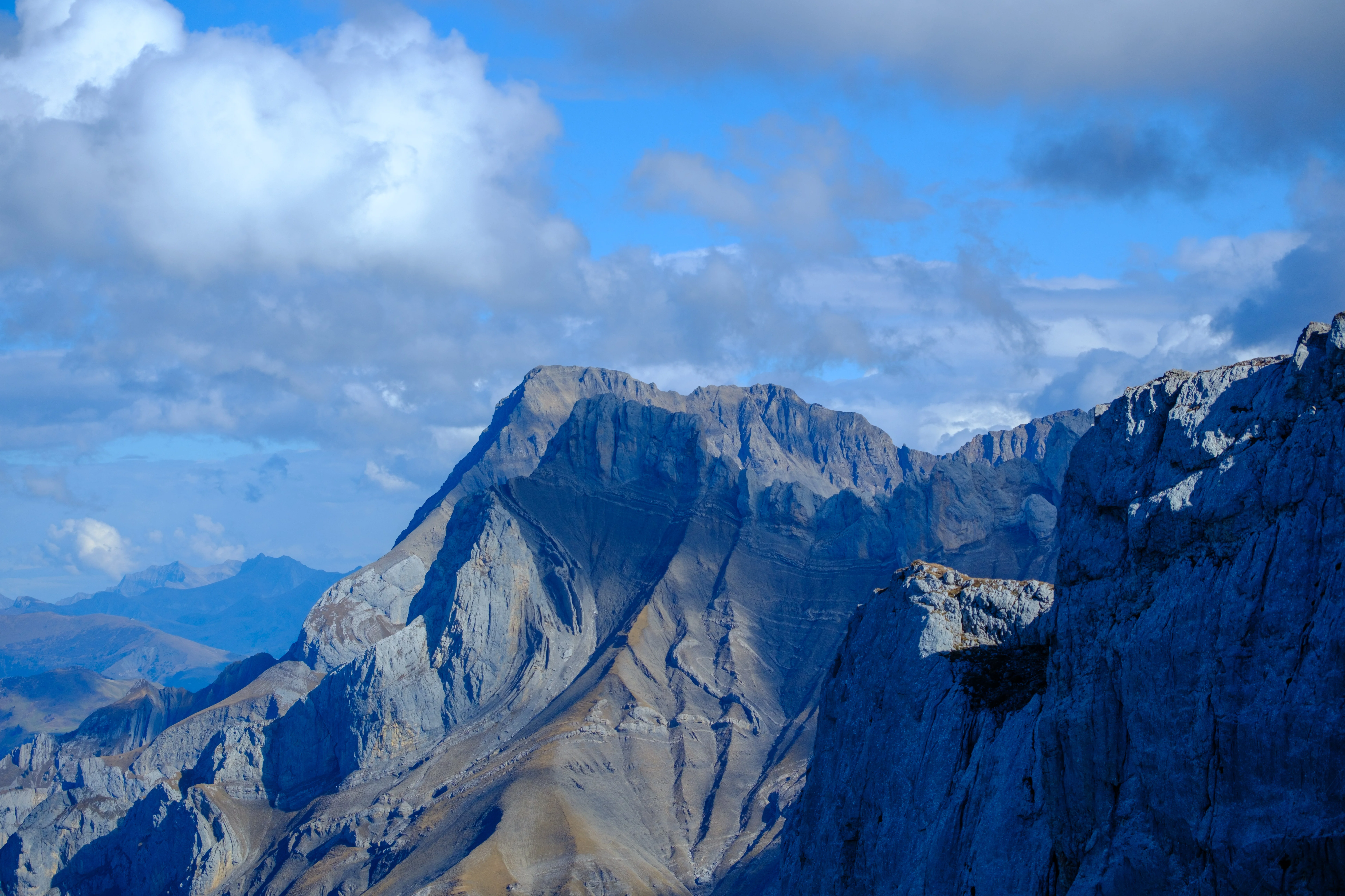 70mm · f/4 · 1/1600s · ISO 125
FUJIFILM X-T5 · XF70-300mmF4-5.6 R LM OIS WR · Oct 24, 2024
Jagged mountain peaks under a blue sky with white clouds.
Saanen, Switzerland
© Brandon Cook
