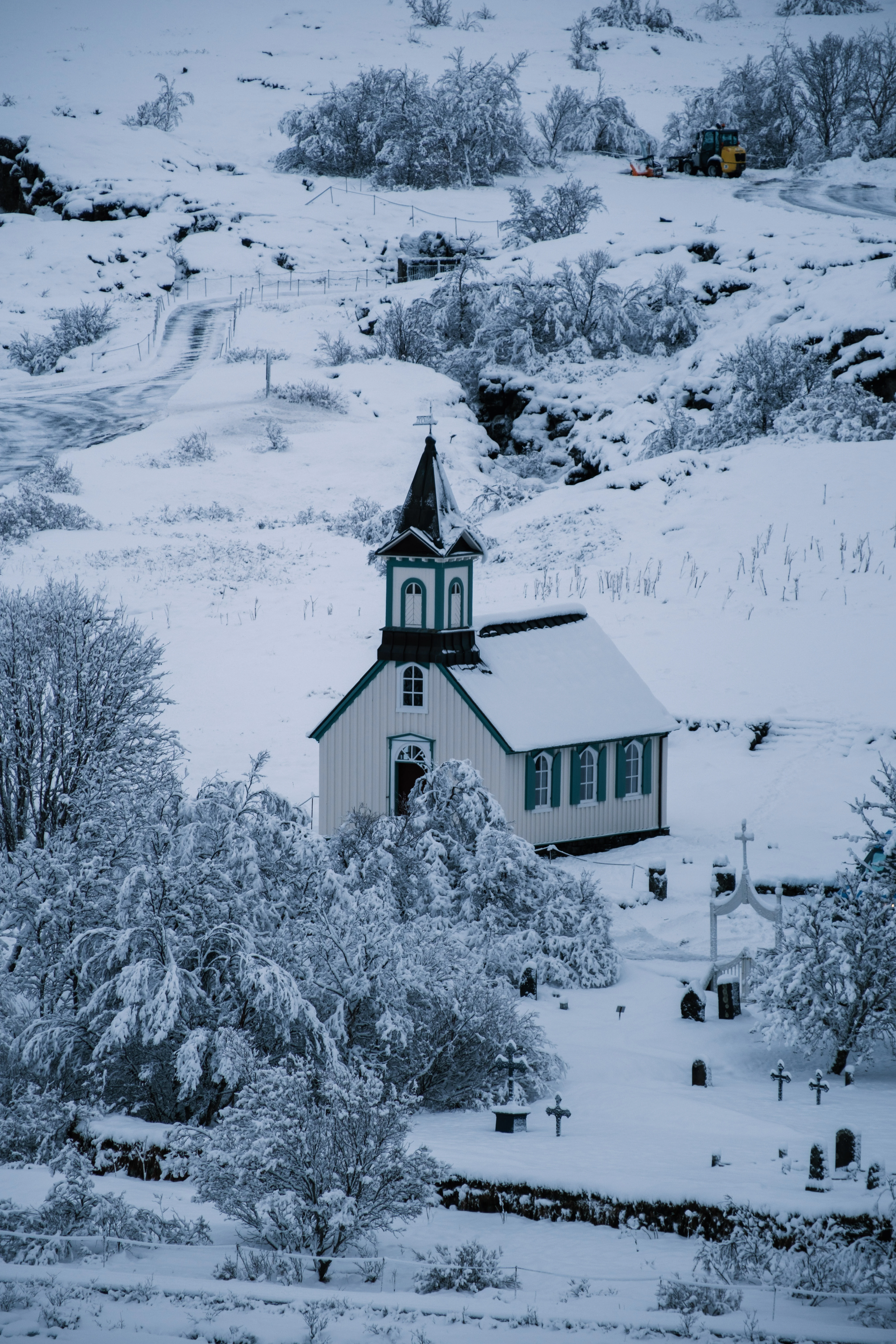 300mm · f/5.6 · 1/280s · ISO 125
FUJIFILM X-T5 · XF70-300mmF4-5.6 R LM OIS WR · Jan 24, 2025
Snowy church and graveyard in a wintry Icelandic landscape.
Selfoss, Iceland
© Brandon Cook