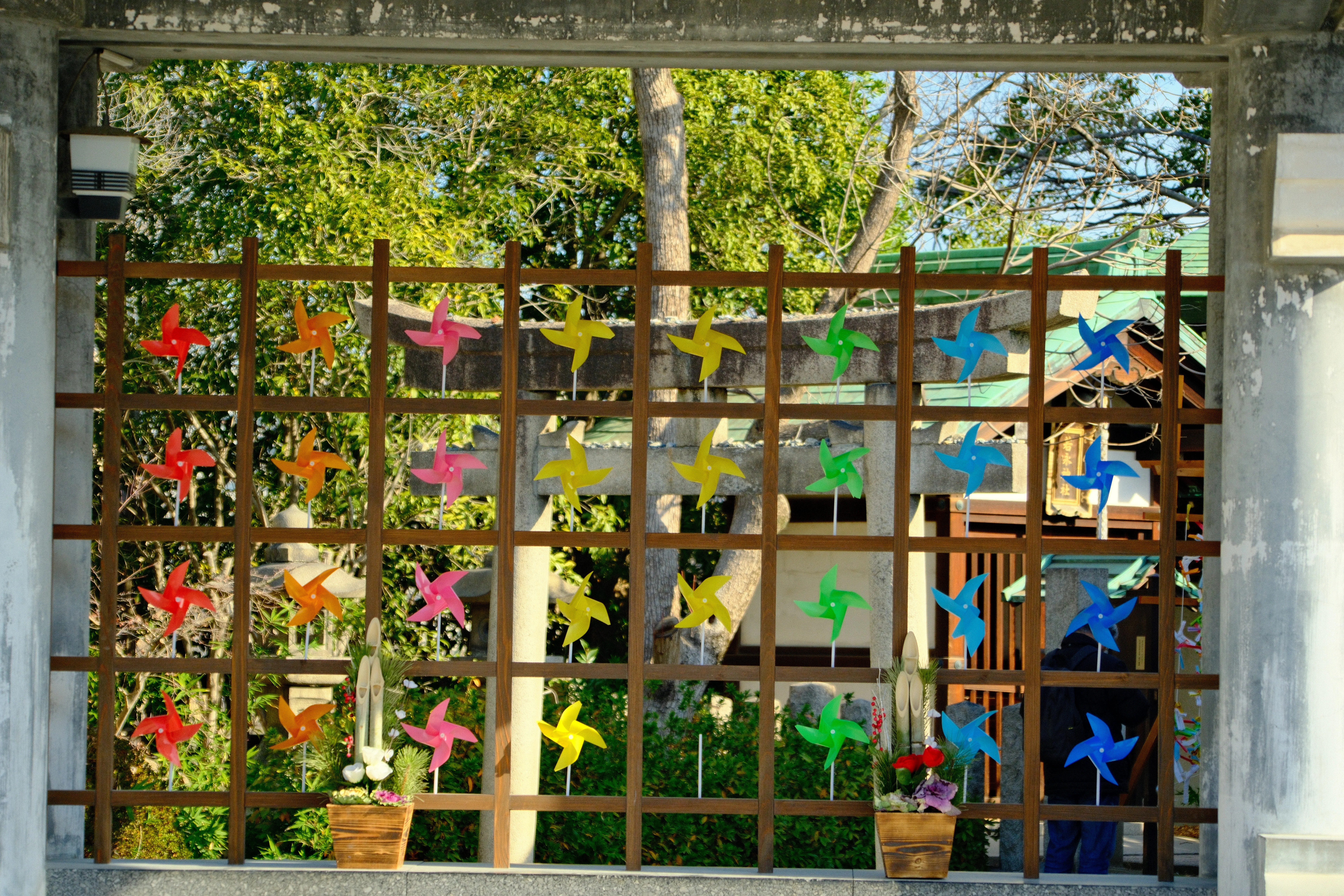 92mm · f/6.3 · 1/400s · ISO 500
FUJIFILM X-T5 · 16-300mm F3.5-6.7 DC OS | Contemporary 025 · Jan 7, 2026
Colorful pinwheels on a wooden lattice at a Japanese shrine.
Osaka, Japan
© Brandon Cook