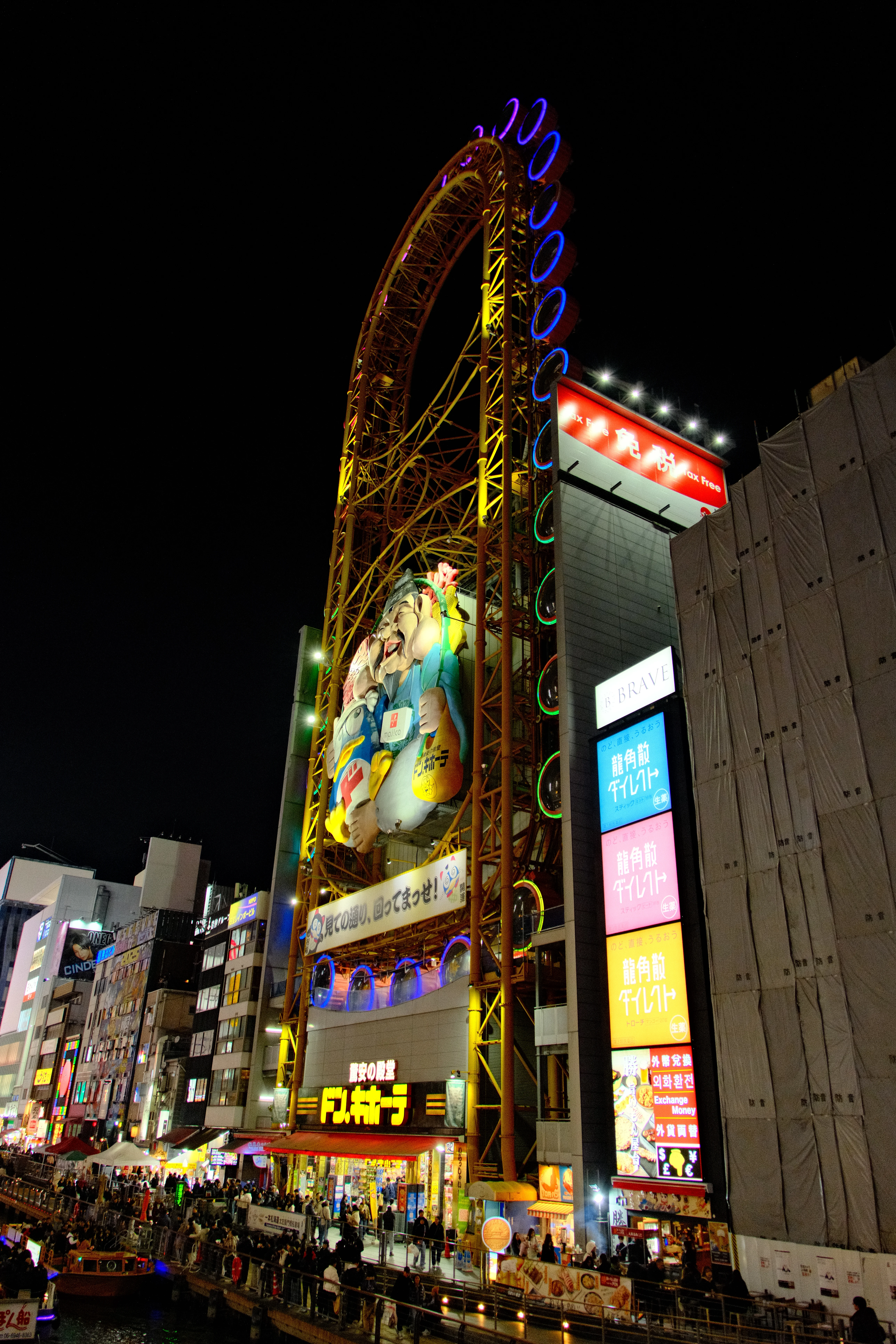 16mm · f/3.5 · 1/125s · ISO 2500
FUJIFILM X-T5 · 16-300mm F3.5-6.7 DC OS | Contemporary 025 · Jan 7, 2026
Illuminated Ferris wheel and colorful neon city signs in Osaka.
Osaka, Japan
© Brandon Cook