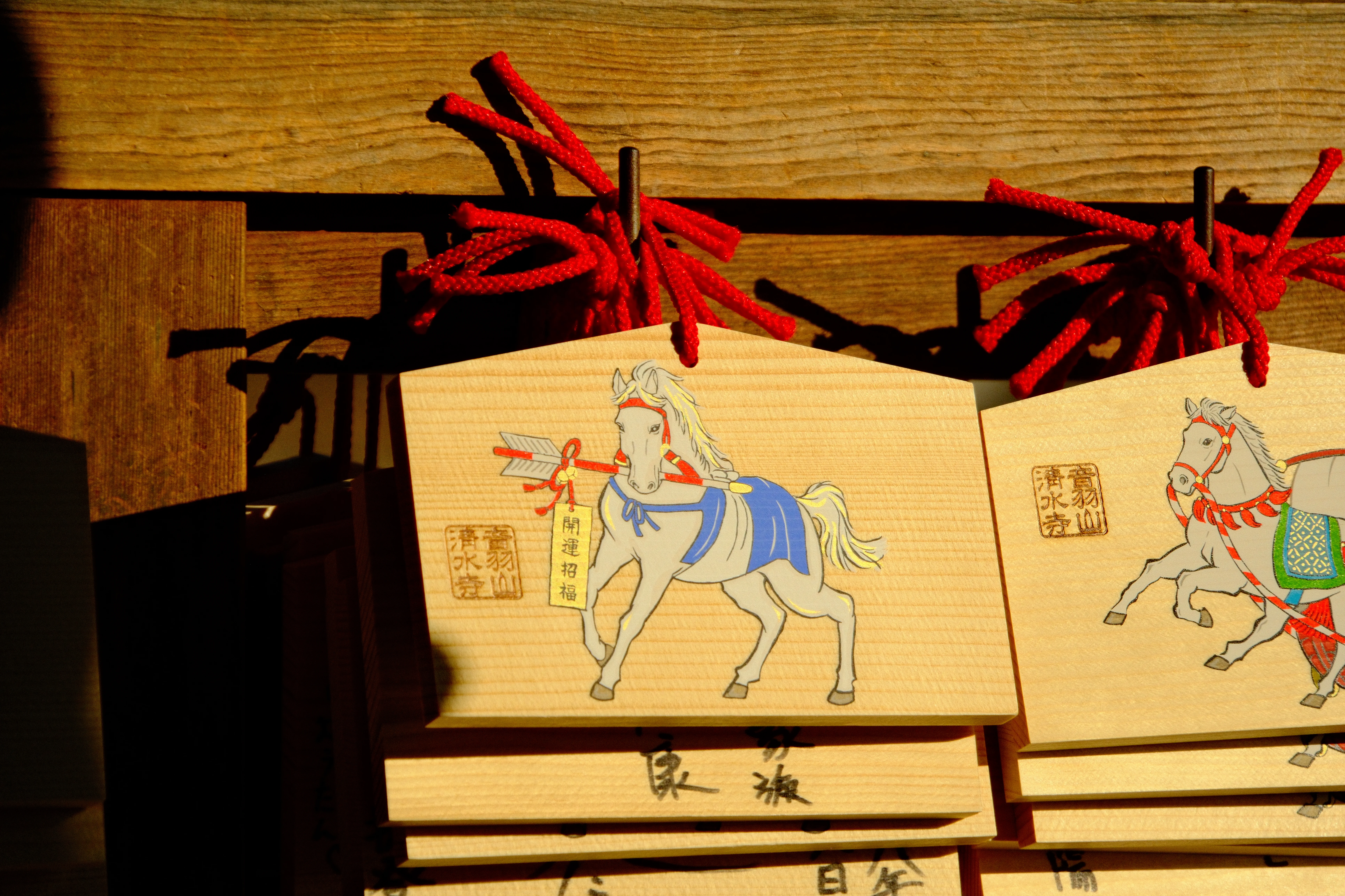 128mm · f/6.3 · 1/3200s · ISO 500
FUJIFILM X-T5 · 16-300mm F3.5-6.7 DC OS | Contemporary 025 · Jan 9, 2026
Wooden horse ema plaques hanging at a shrine in Kyoto.
Kyoto, Japan
© Brandon Cook