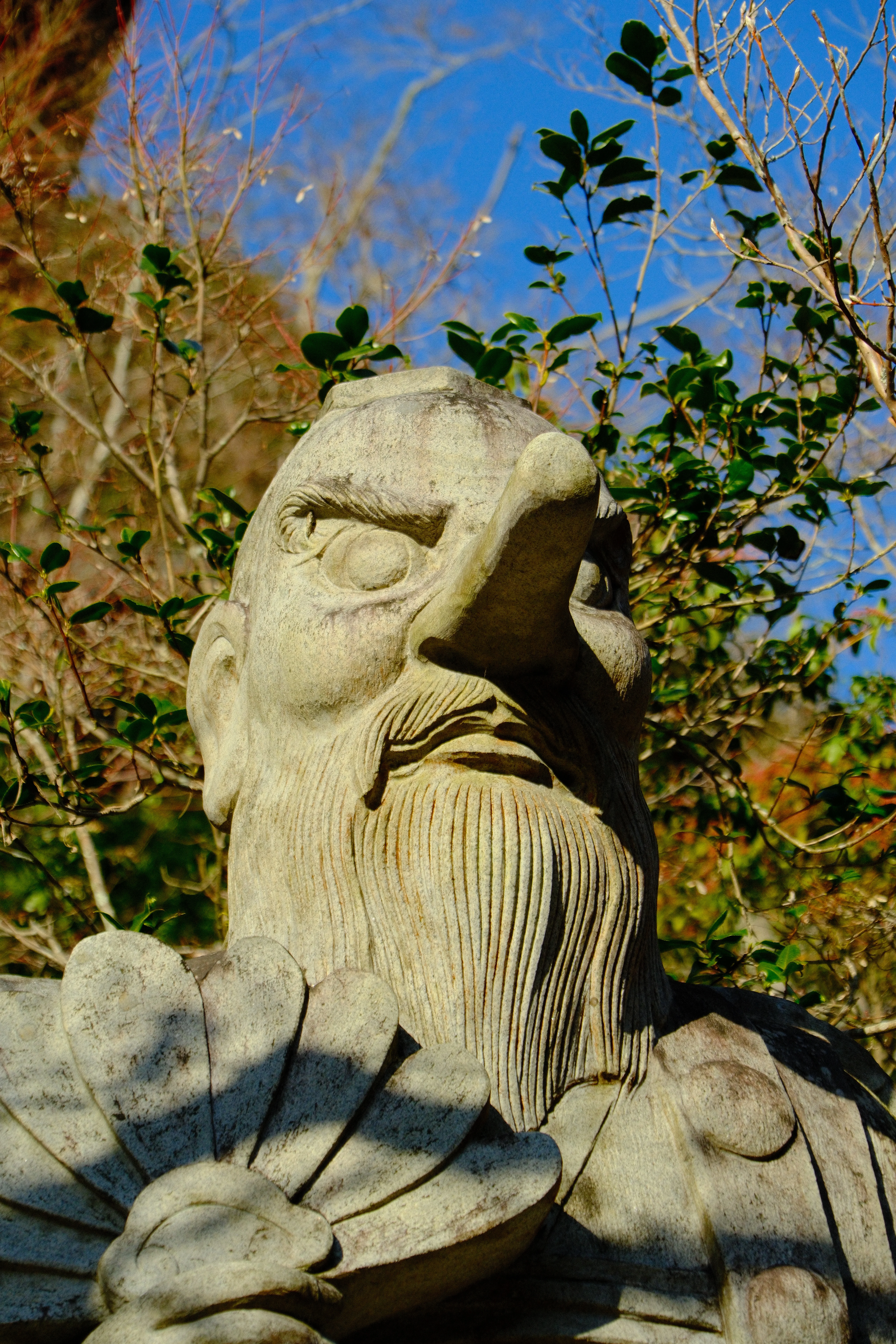 75mm · f/6.3 · 1/1600s · ISO 500
FUJIFILM X-T5 · 16-300mm F3.5-6.7 DC OS | Contemporary 025 · Jan 12, 2026
Close-up of weathered stone statue with long nose and beard.
Hiroshima, Japan
© Brandon Cook