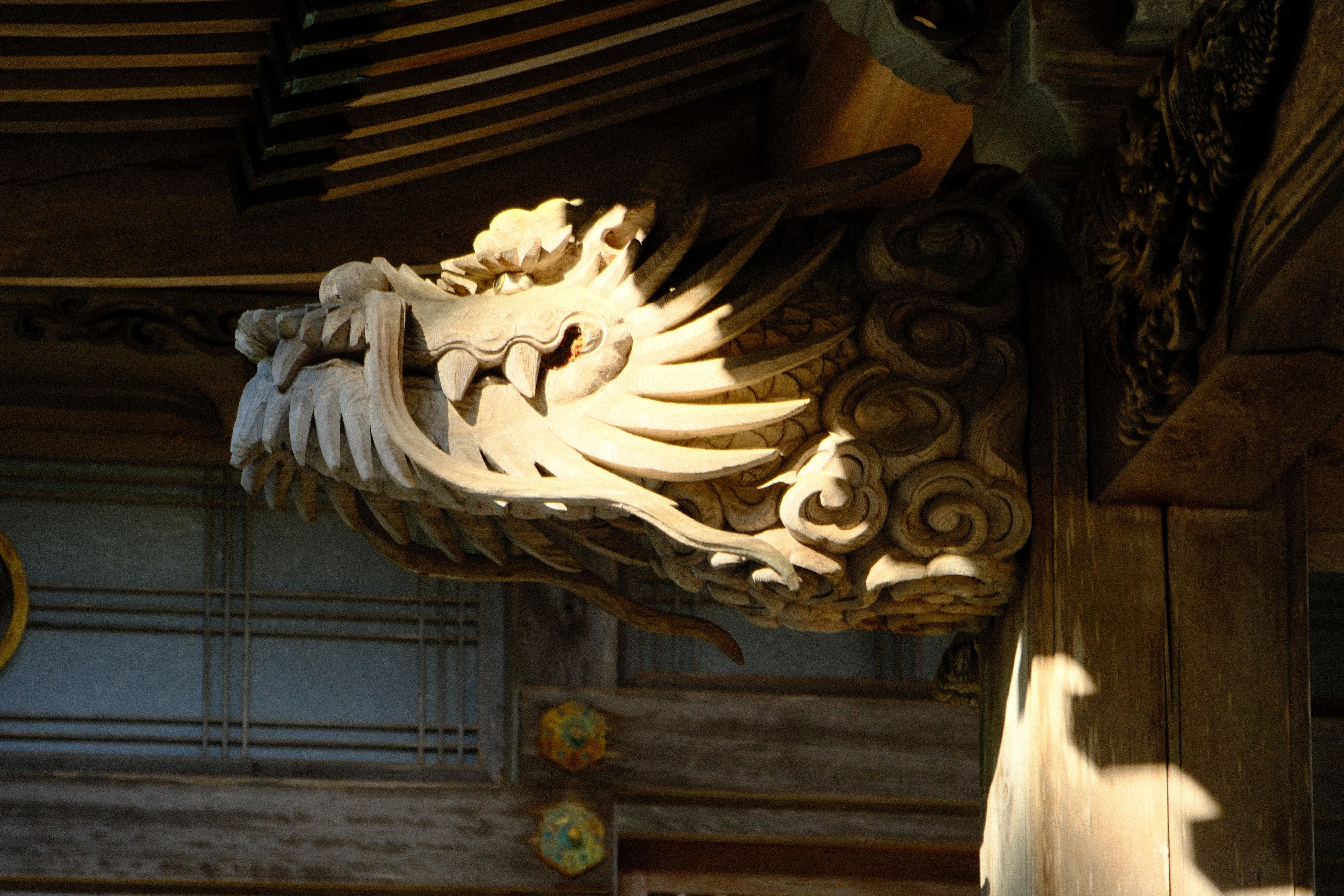 128mm · f/6.3 · 1/125s · ISO 500
FUJIFILM X-T5 · 16-300mm F3.5-6.7 DC OS | Contemporary 025 · Jan 12, 2026
Intricate wooden dragon head carving on a traditional Japanese temple.
Hiroshima, Japan
© Brandon Cook