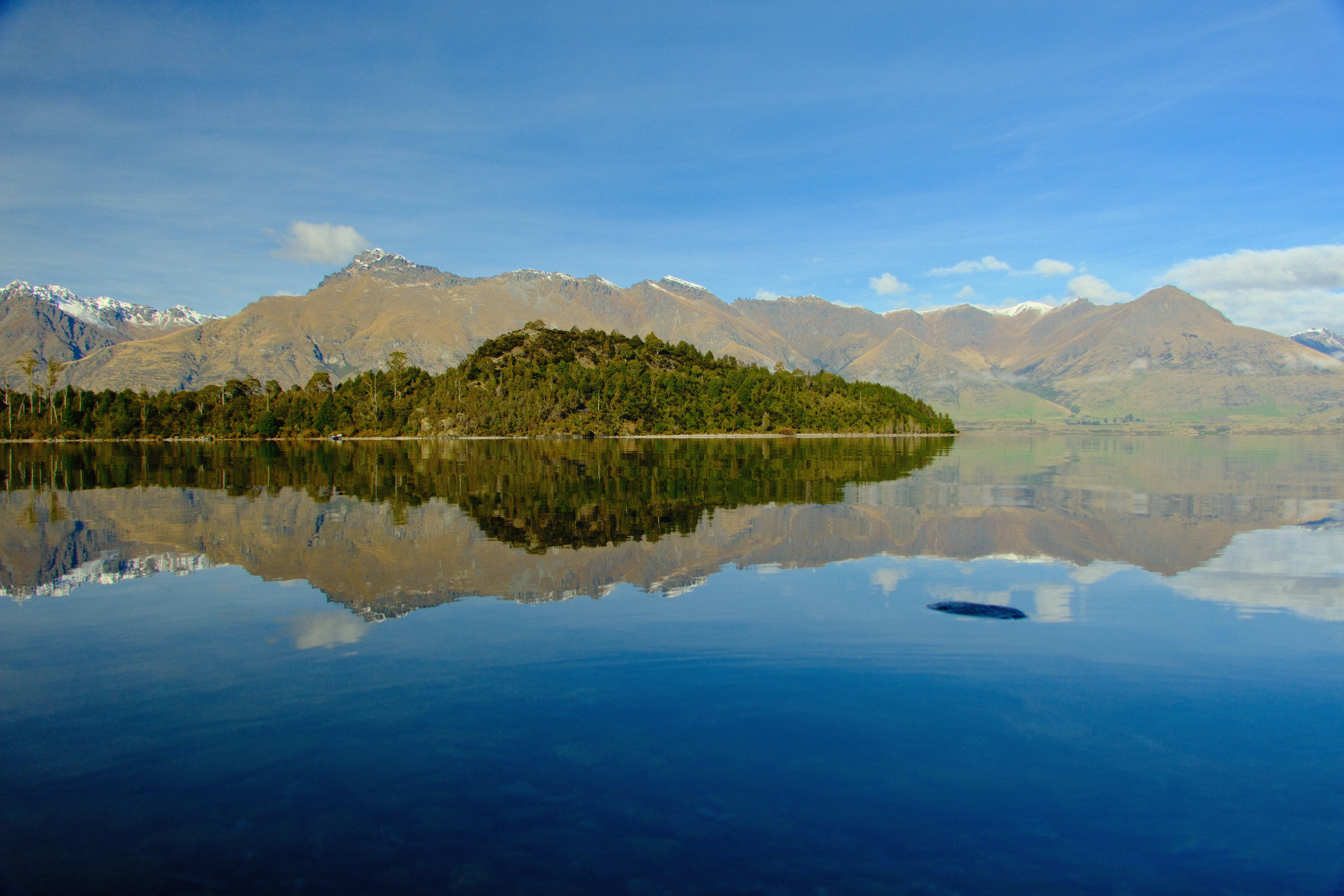 16mm · f/6.3 · 1/550s · ISO 500
FUJIFILM X-T5 · 16-300mm F3.5-6.7 DC OS | Contemporary 025 · Jul 28, 2026
Tranquil lake reflects lush green island and majestic mountains.
Bob's Cove, New Zealand
© Brandon Cook